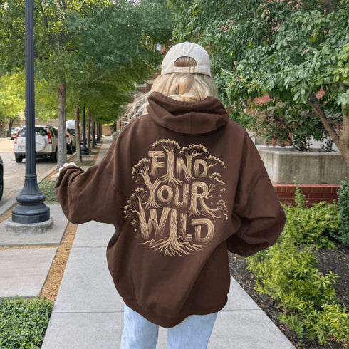 Featuring the bold phrase "Find Your Wild" crafted in a unique tree branch letter font, this hoodie is a celebration of the untamed beauty of the forest and the freedom it inspires.